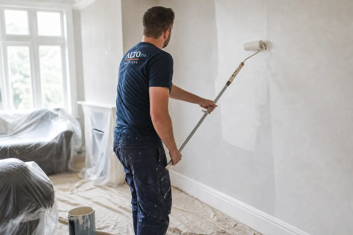 Alto Pro painter rolling a fresh coat onto an interior wall